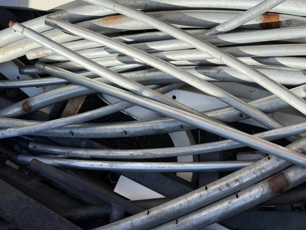 Stacked structural steel pipes and metal sections showing common sourcing mistakes builders should avoid in Australia